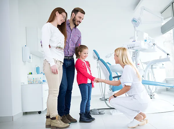 Dentist Austin TX Kid Giving Handshake to Dentist Family Visit