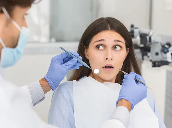 Dentist Austin TX Nervous Patient During Dental Procedure