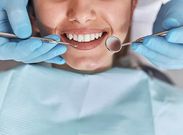 Dentist Austin TX Smiling Patient During Dental Checkup Closeup